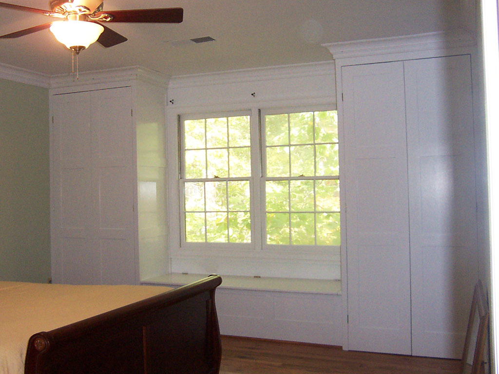 Bedroom Built-in Closet Cabinetry and Window Seat