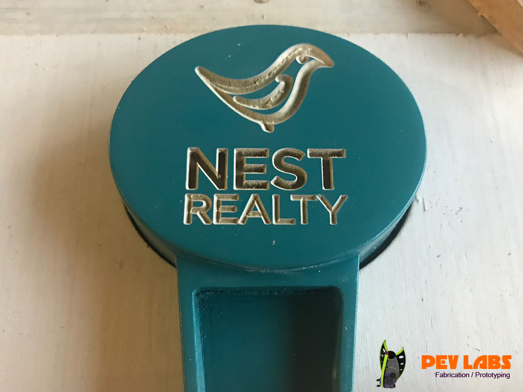 Tap Handle Logo Engraved Nest Realty